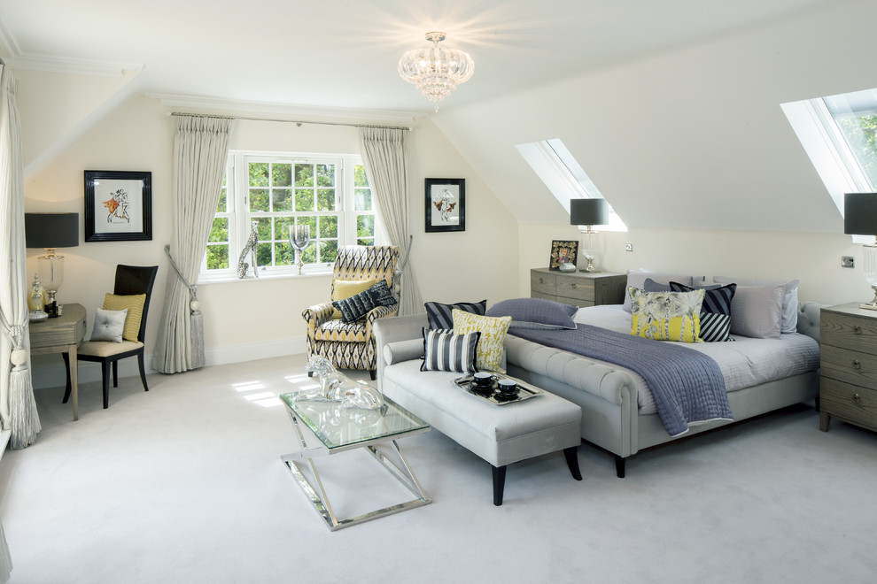 Inspiration for a mid-sized transitional master bedroom in Berkshire with white walls and carpet.