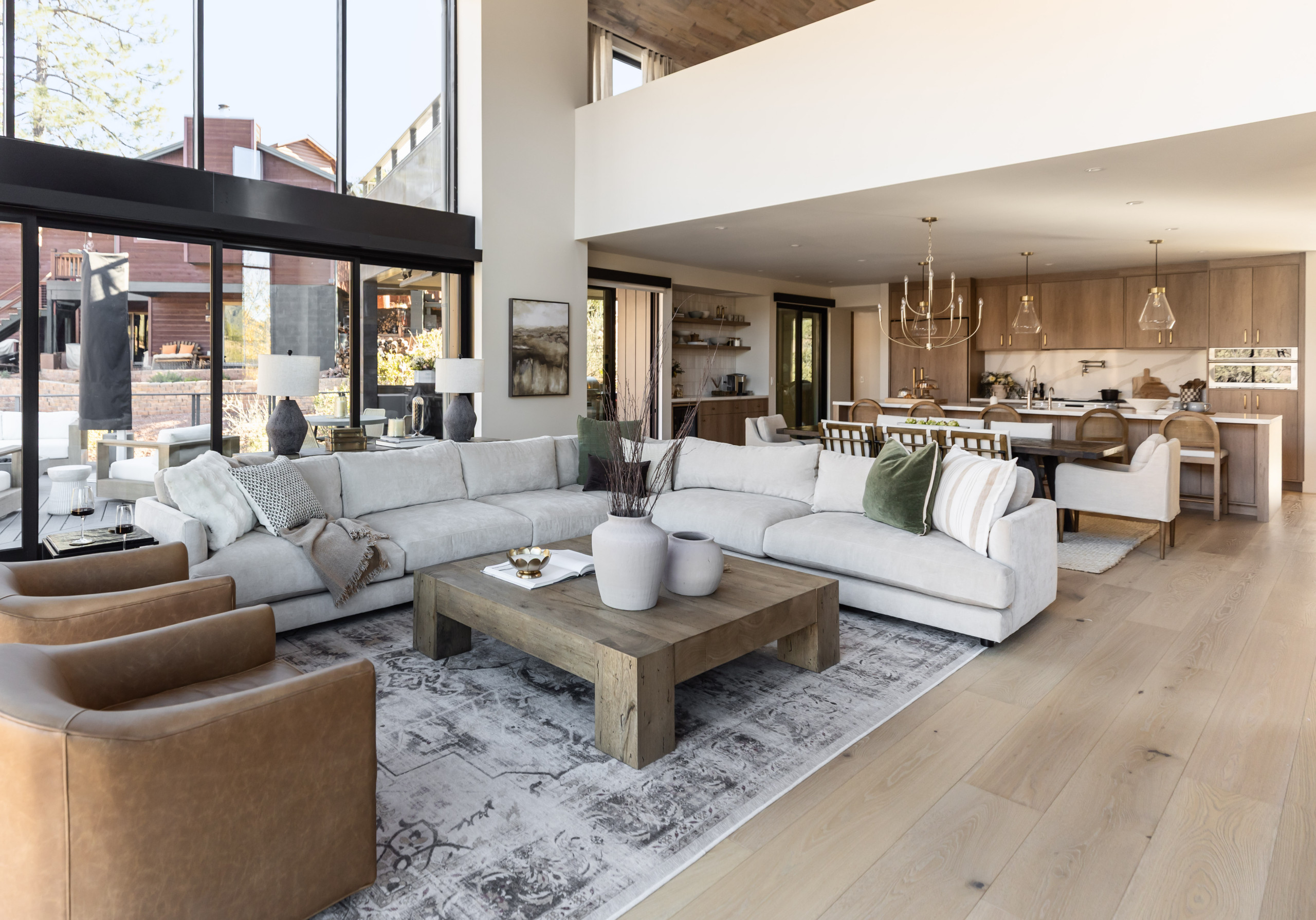 Inspiration for a transitional open concept light wood floor and beige floor living room remodel in Phoenix with white walls