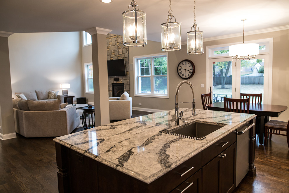 Eat-in kitchen - large transitional single-wall dark wood floor eat-in kitchen idea in Chicago with an undermount sink, shaker cabinets, white cabinets, marble countertops, multicolored backsplash, matchstick tile backsplash, stainless steel appliances and an island