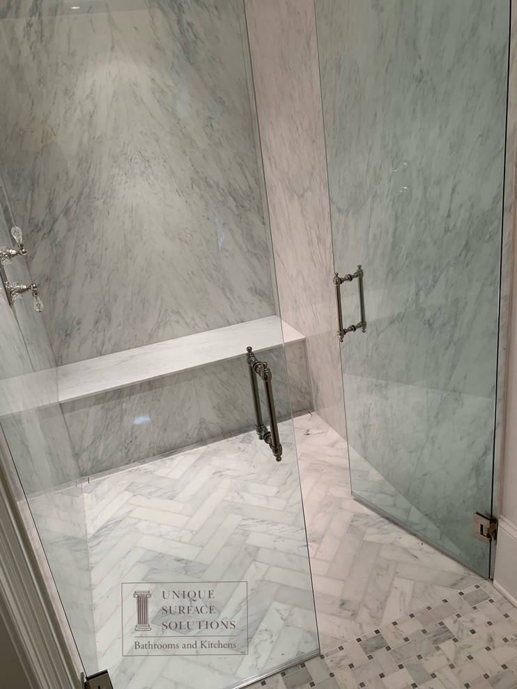 Inspiration for a mid-sized contemporary master bathroom in Atlanta with white tile, stone slab, white walls, a hinged shower door, marble floors, white floor and an alcove shower.