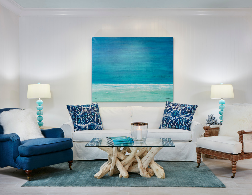 This is an example of a large beach style formal open concept living room in Miami with white walls, porcelain floors, no fireplace, no tv and brown floor.
