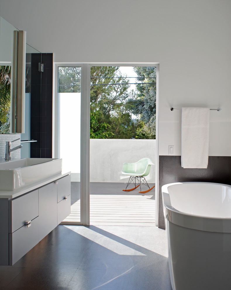 Design ideas for a contemporary bathroom in Other with a vessel sink.