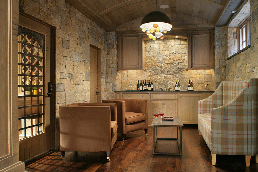Inspiration for a traditional wine cellar in New York with dark hardwood floors and brown floor.