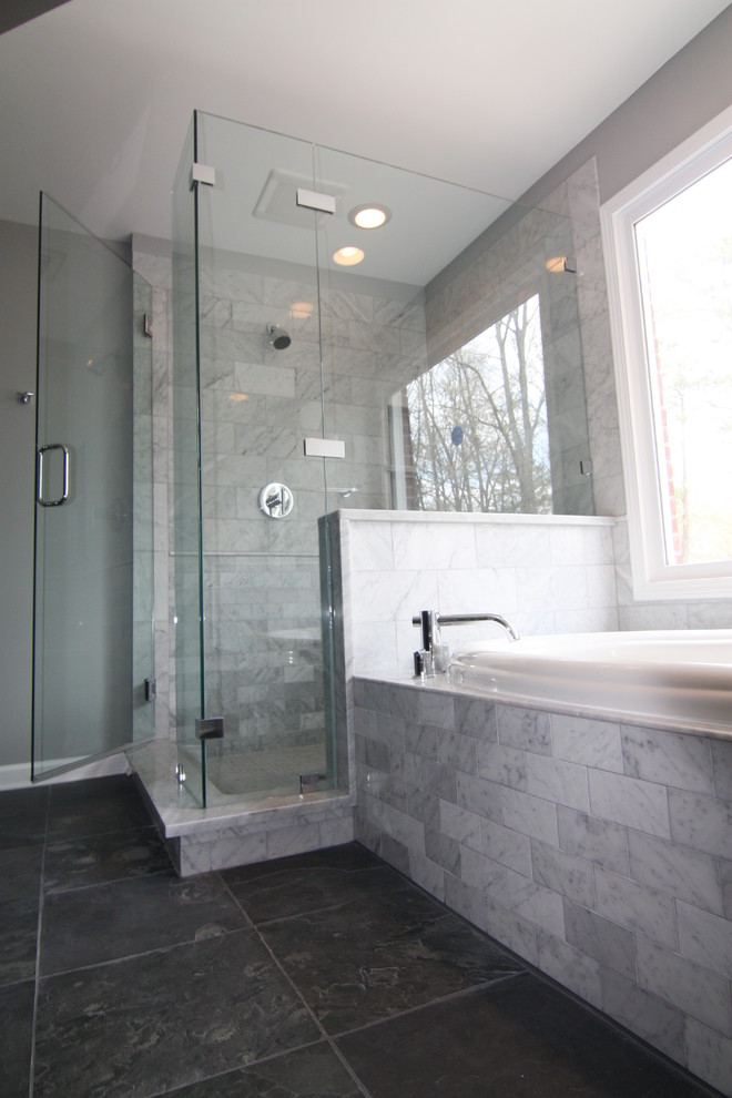 Inspiration for a large contemporary master bathroom in Atlanta with marble benchtops, a drop-in tub, a corner shower, gray tile, stone tile, grey walls and slate floors.