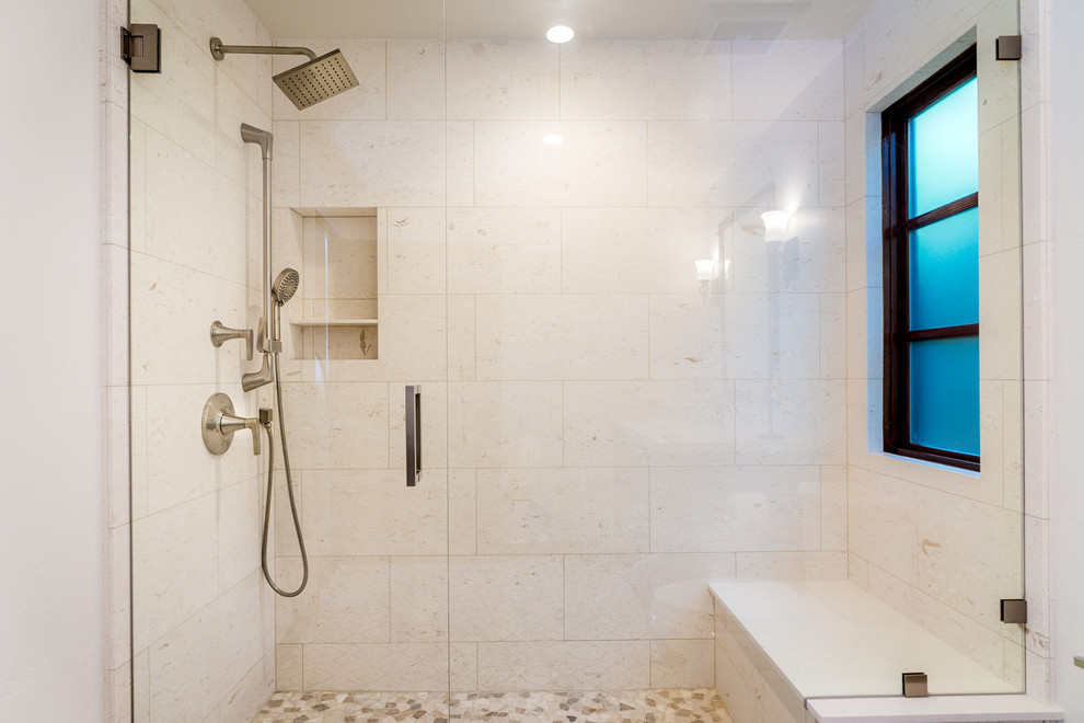 Design ideas for a mediterranean 3/4 bathroom in Los Angeles with raised-panel cabinets, medium wood cabinets, an alcove shower, a wall-mount toilet, white tile, limestone, white walls, cement tiles, an undermount sink, engineered quartz benchtops, multi-coloured floor and a hinged shower door.