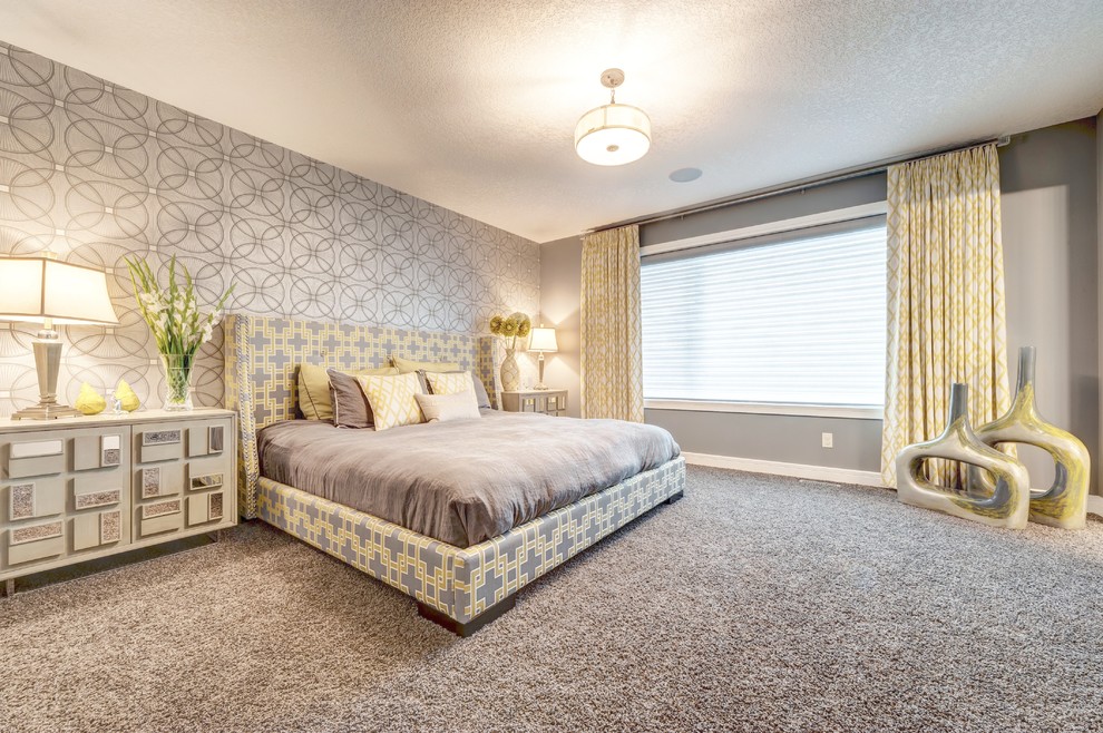 Inspiration for a transitional master bedroom in Calgary with grey walls and carpet.