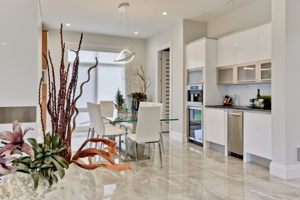 Kitchen/dining room combo - large modern ceramic tile and beige floor kitchen/dining room combo idea in Edmonton with white walls