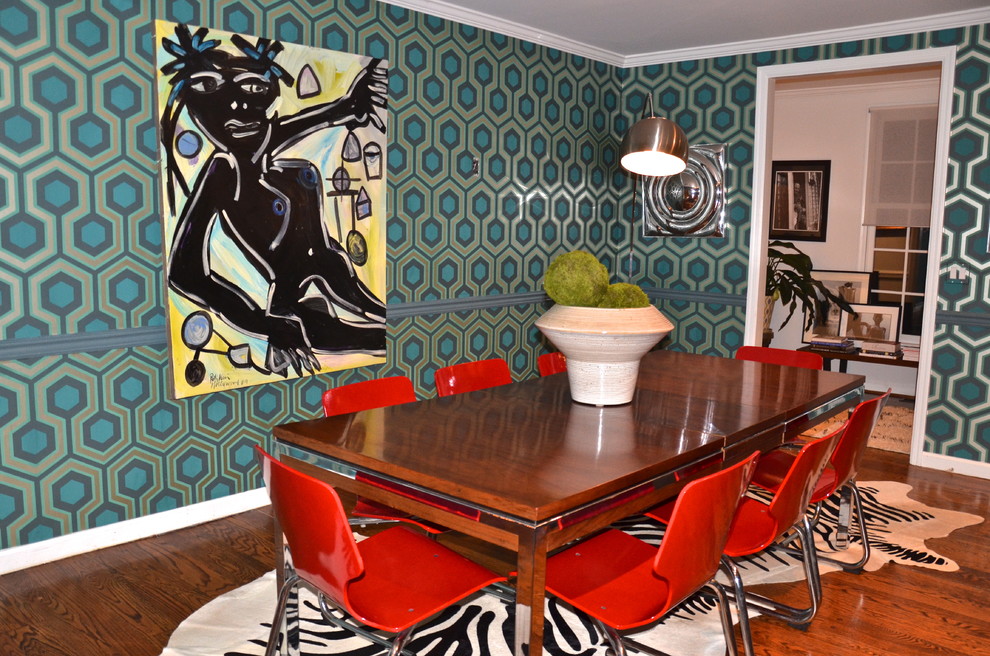 Photo of a midcentury separate dining room in New York with multi-coloured walls and dark hardwood floors.