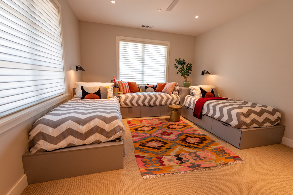 This is an example of a large country gender-neutral kids' bedroom for kids 4-10 years old in San Francisco with grey walls, carpet and beige floor.