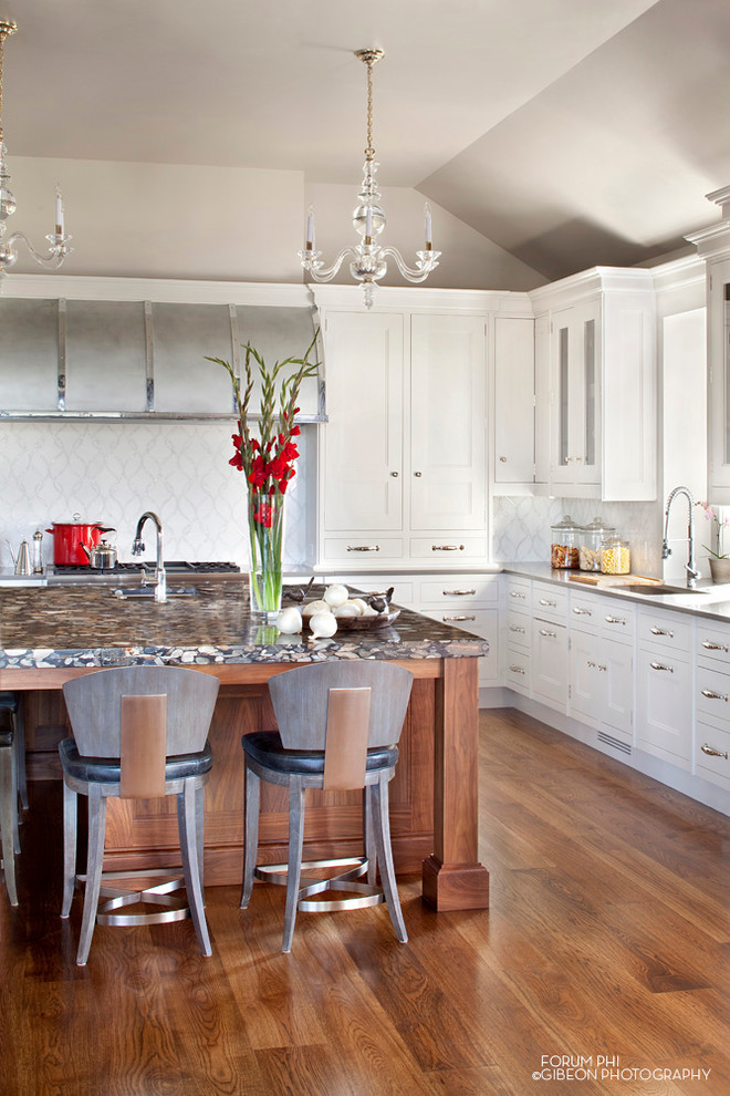 Example of a transitional u-shaped eat-in kitchen design in Denver with an undermount sink, recessed-panel cabinets, white cabinets, solid surface countertops, white backsplash, mosaic tile backsplash and stainless steel appliances