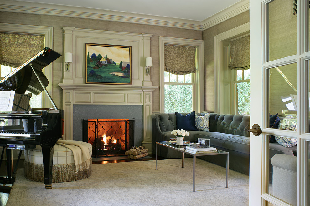 This is an example of a mid-sized traditional enclosed living room in New York with a music area, beige walls, dark hardwood floors, a standard fireplace, no tv and a stone fireplace surround.