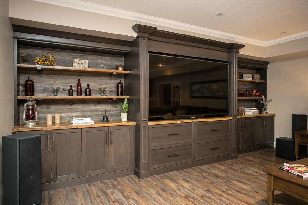 This is an example of a large country open concept home theatre in Toronto with grey walls, vinyl floors, a built-in media wall and brown floor.