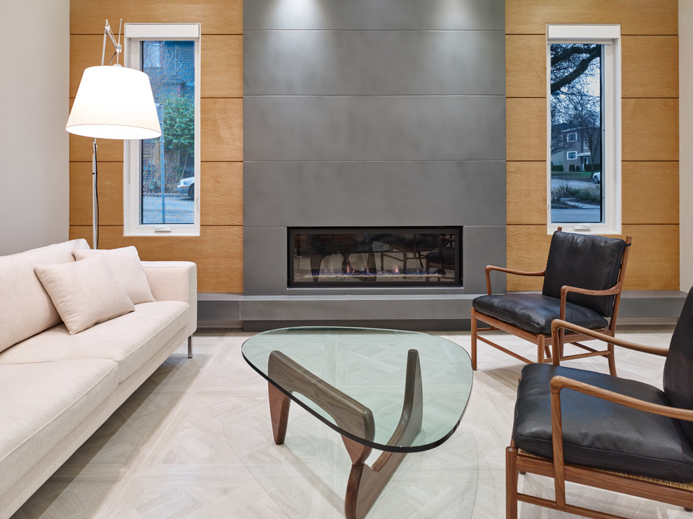 Contemporary formal open concept living room in Vancouver with multi-coloured walls, porcelain floors, a standard fireplace, a concrete fireplace surround and no tv.