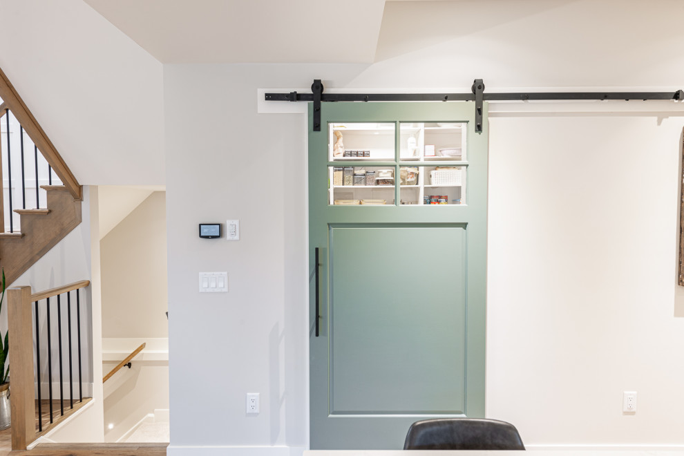 Eat-in kitchen - mid-sized transitional l-shaped laminate floor and brown floor eat-in kitchen idea in Toronto with an undermount sink, recessed-panel cabinets, white cabinets, quartz countertops, stainless steel appliances, an island and white countertops