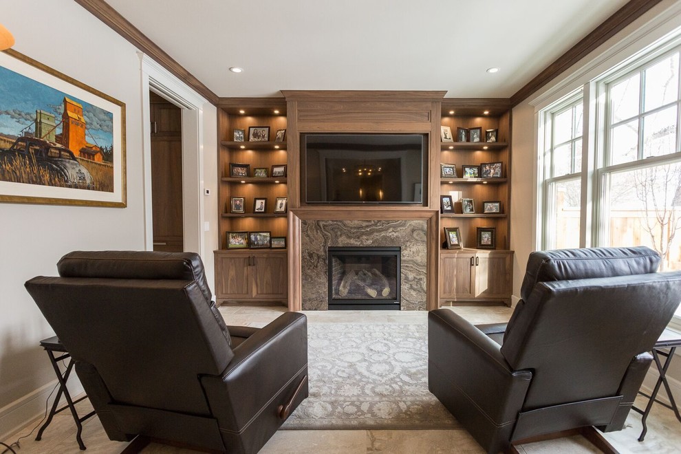 This is an example of a mid-sized traditional formal enclosed living room in Calgary with white walls, travertine floors, a standard fireplace, a stone fireplace surround and a built-in media wall.
