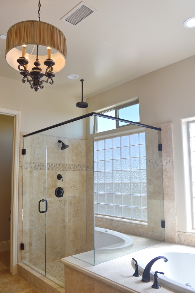 Drop-in bathtub - mid-sized transitional master beige tile and ceramic tile travertine floor drop-in bathtub idea with shaker cabinets, dark wood cabinets, beige walls, an undermount sink and marble countertops