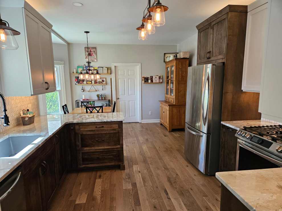 Eat-in kitchen - mid-sized transitional eat-in kitchen idea in Nashville with shaker cabinets and quartz countertops