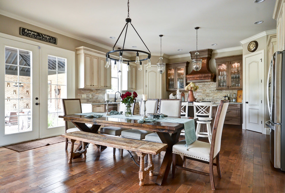 This is an example of a traditional kitchen/dining combo in Other with beige walls and dark hardwood floors.