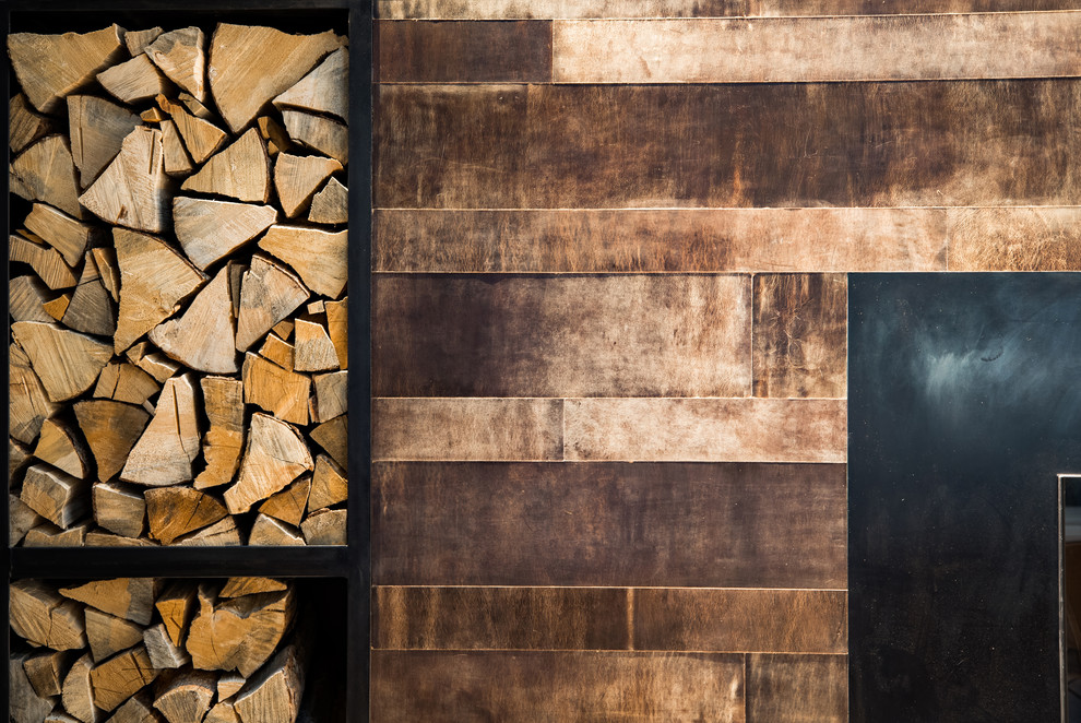 Textured Wall and Rustic Fireplace Surround - The mosaic stone wall and dark wood surround create a visual interest, that adds beauty to the room.

Built by ULFBUILT - General contractor of custom homes in Vail and Beaver Creek. Contact us today to learn more.