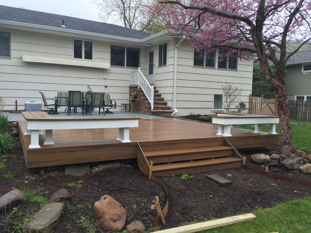 Photo of a mid-sized modern backyard deck in New York with no cover.