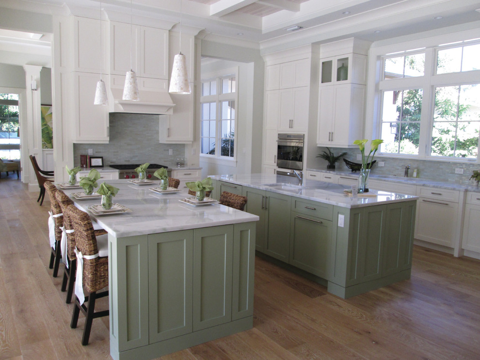 Transitional eat-in kitchen photo in Miami with a single-bowl sink, shaker cabinets, white cabinets and two islands