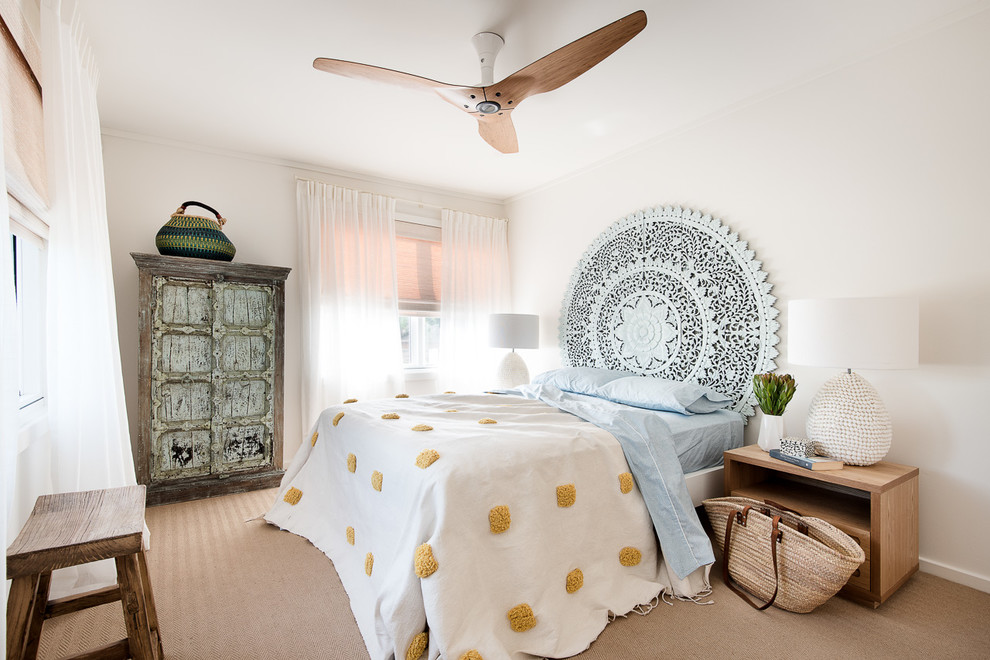 Inspiration for a beach style bedroom in Sydney with white walls, carpet and beige floor.
