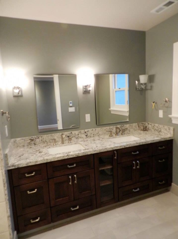 This is an example of a mid-sized eclectic master bathroom in San Francisco with shaker cabinets, dark wood cabinets, an alcove shower, a two-piece toilet, white tile, ceramic tile, green walls, ceramic floors, an undermount sink and engineered quartz benchtops.