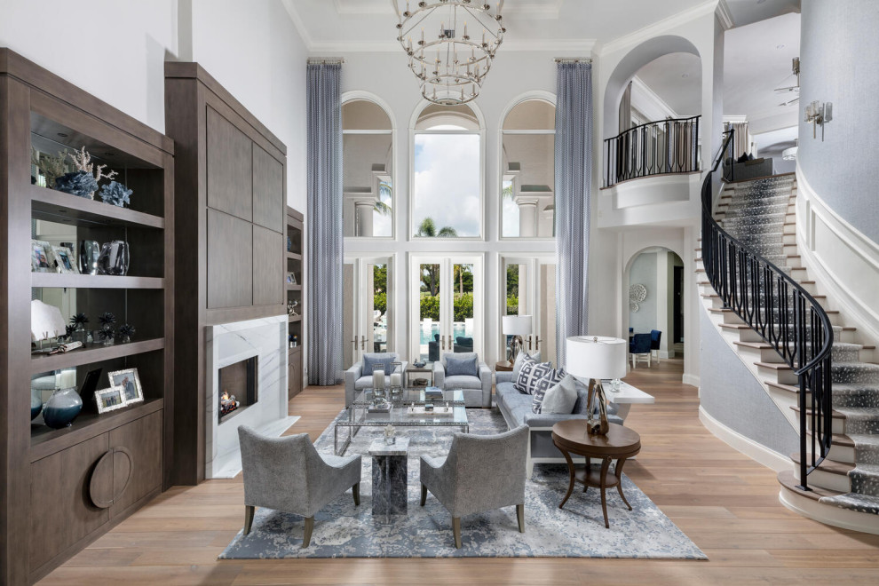 Inspiration for an expansive traditional formal open plan living room in Miami with grey walls, medium hardwood flooring, a standard fireplace, a stone fireplace surround, no tv, brown floors, a coffered ceiling and wallpapered walls.
