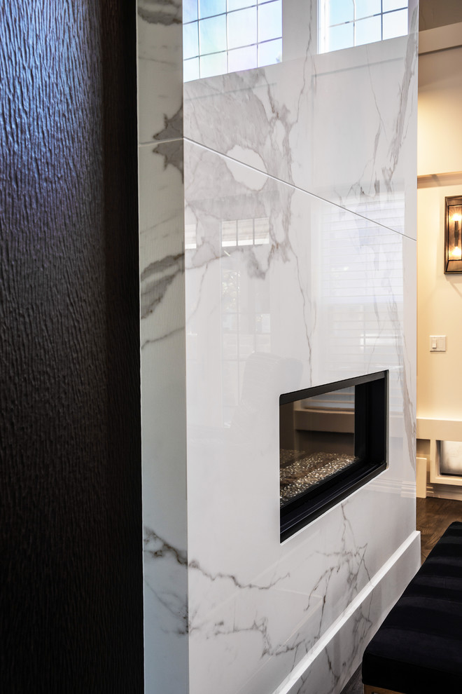 Example of a large trendy open concept dark wood floor family room design with a two-sided fireplace, a tile fireplace and a media wall