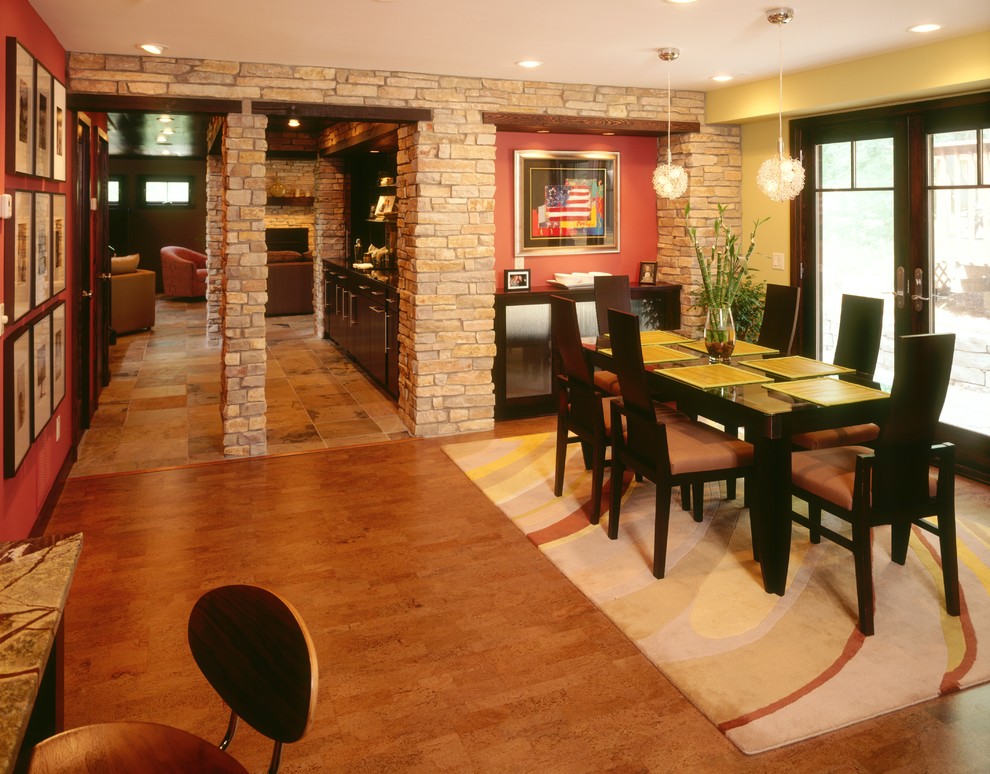 Traditional separate dining room in Minneapolis with yellow walls and cork floors.