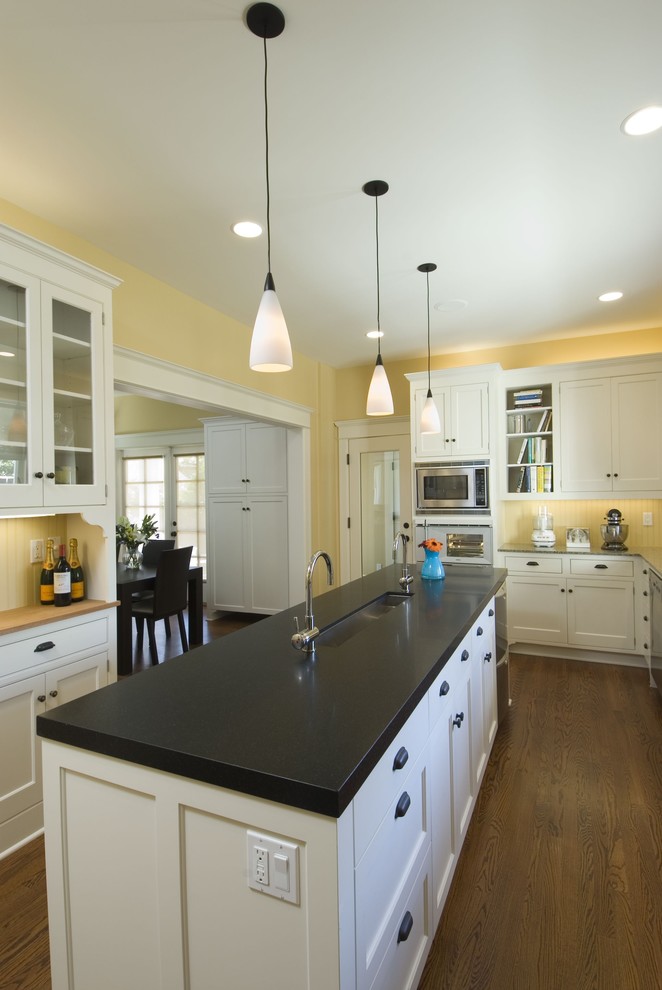 Design ideas for a traditional kitchen in Seattle with an undermount sink, recessed-panel cabinets and white cabinets.