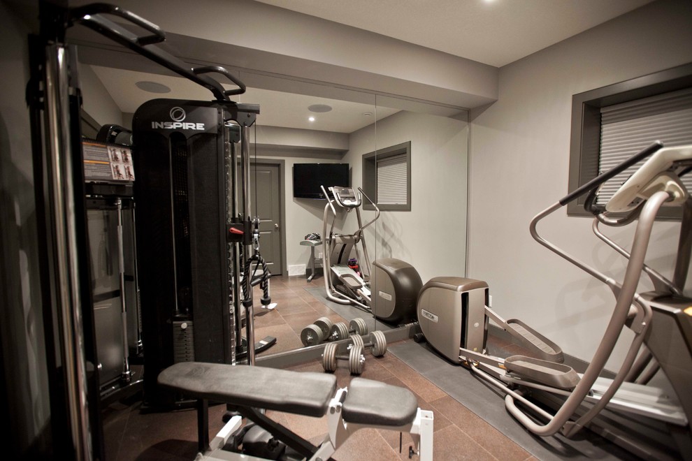 Photo of a contemporary home gym in Calgary.