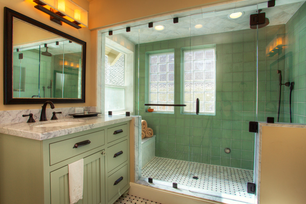 Inspiration for an arts and crafts bathroom in Sacramento with an undermount sink, flat-panel cabinets, green cabinets, an alcove shower, green tile, multi-coloured floor and grey benchtops.