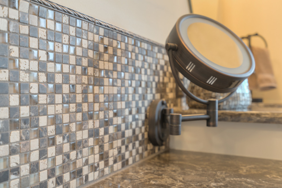 Home design - mid-sized transitional master multicolored tile ceramic tile home design idea with raised-panel cabinets, beige cabinets, a two-piece toilet, beige walls, an undermount sink and quartz countertops
