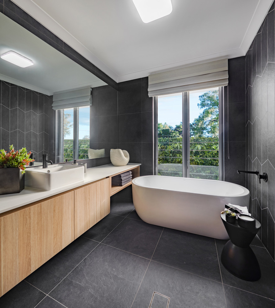 Inspiration for a mid-sized contemporary bathroom in Sydney with a freestanding tub, a corner shower, a hinged shower door and a single vanity.