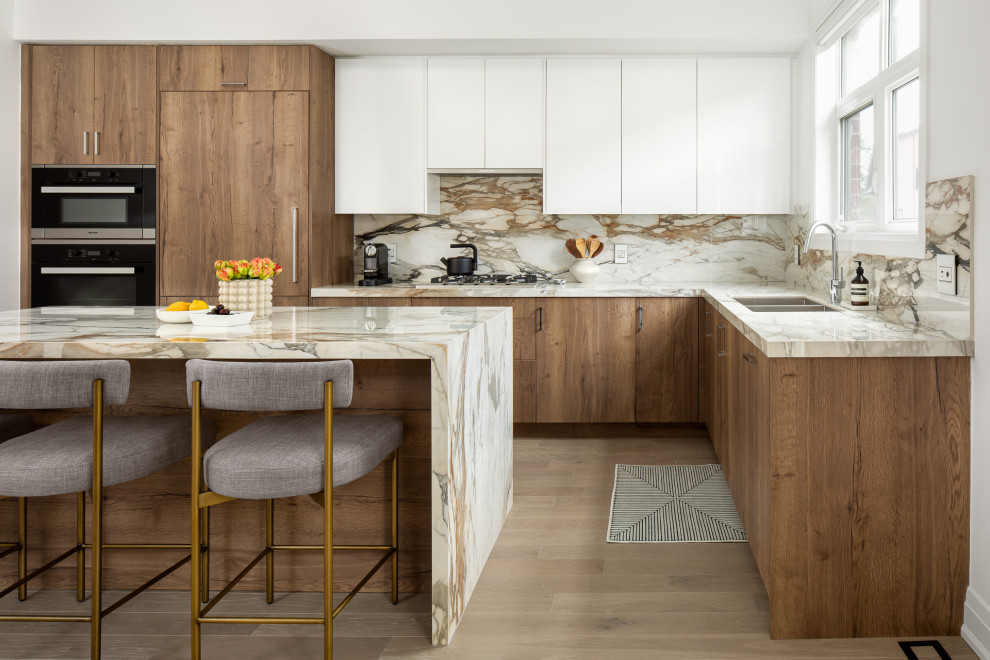 Design ideas for a large contemporary l-shaped eat-in kitchen in Toronto with a double-bowl sink, flat-panel cabinets, brown cabinets, wood benchtops, multi-coloured splashback, engineered quartz splashback, panelled appliances, light hardwood floors, with island, beige floor and multi-coloured benchtop.