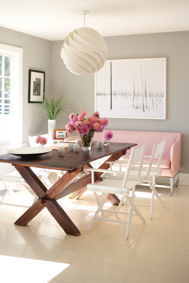 Design ideas for a contemporary dining room in New York with grey walls, painted wood floors and white floor.