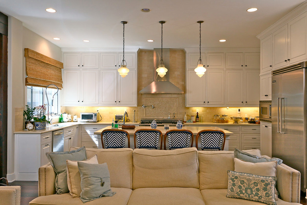 Photo of a beach style kitchen in Los Angeles with stainless steel appliances and with island.