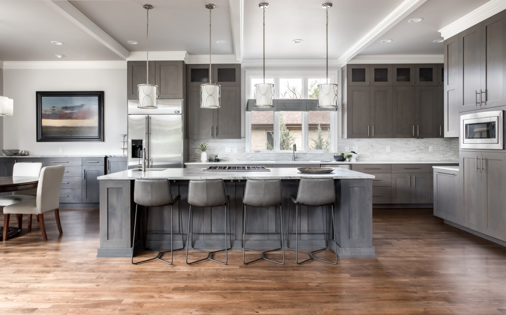 Example of a transitional kitchen design in Denver