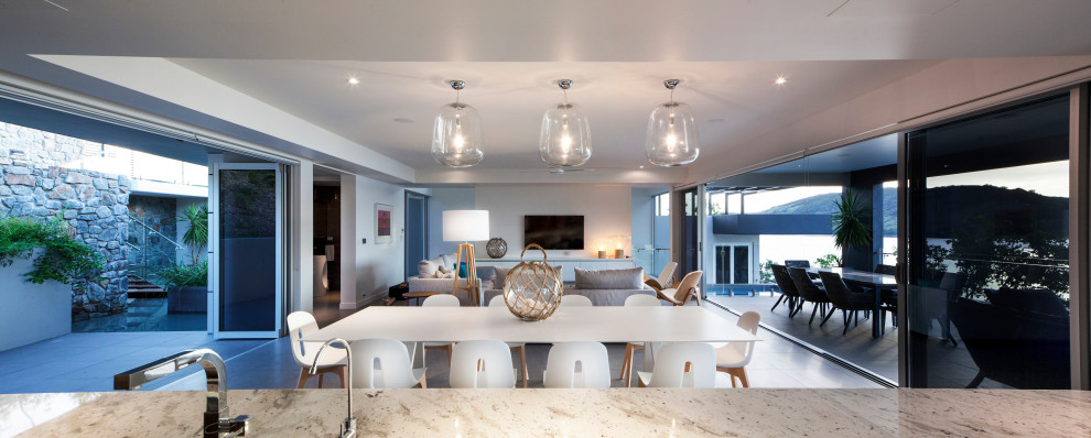 Example of a beach style dining room design in Melbourne