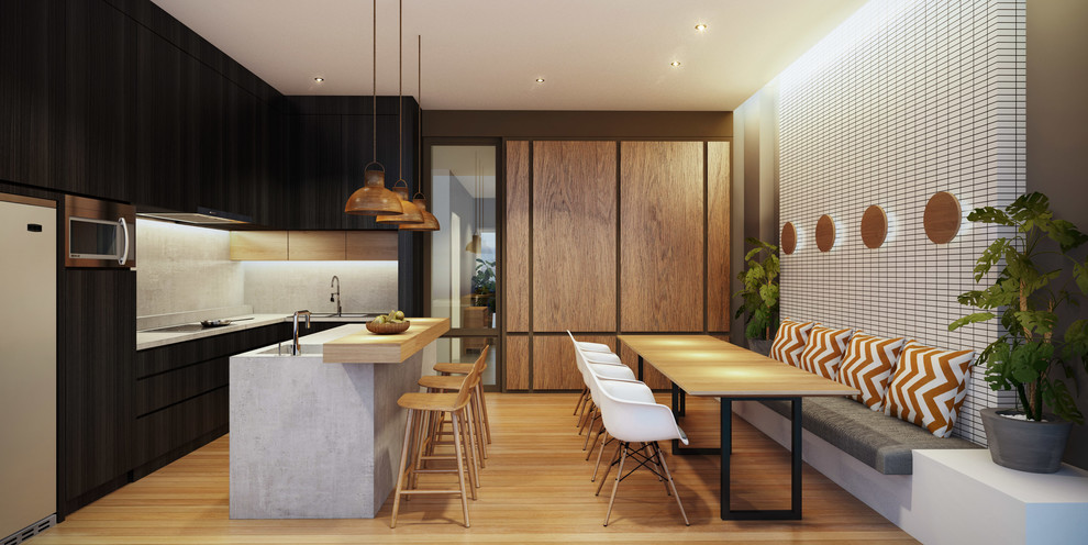 This is an example of a mid-sized scandinavian l-shaped eat-in kitchen in Other with a drop-in sink, flat-panel cabinets, black cabinets, concrete benchtops, grey splashback, stone tile splashback, stainless steel appliances, light hardwood floors and with island.