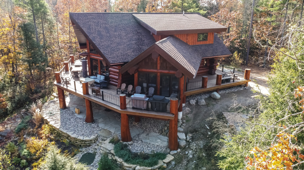 Deck - huge rustic second story mixed material railing deck idea