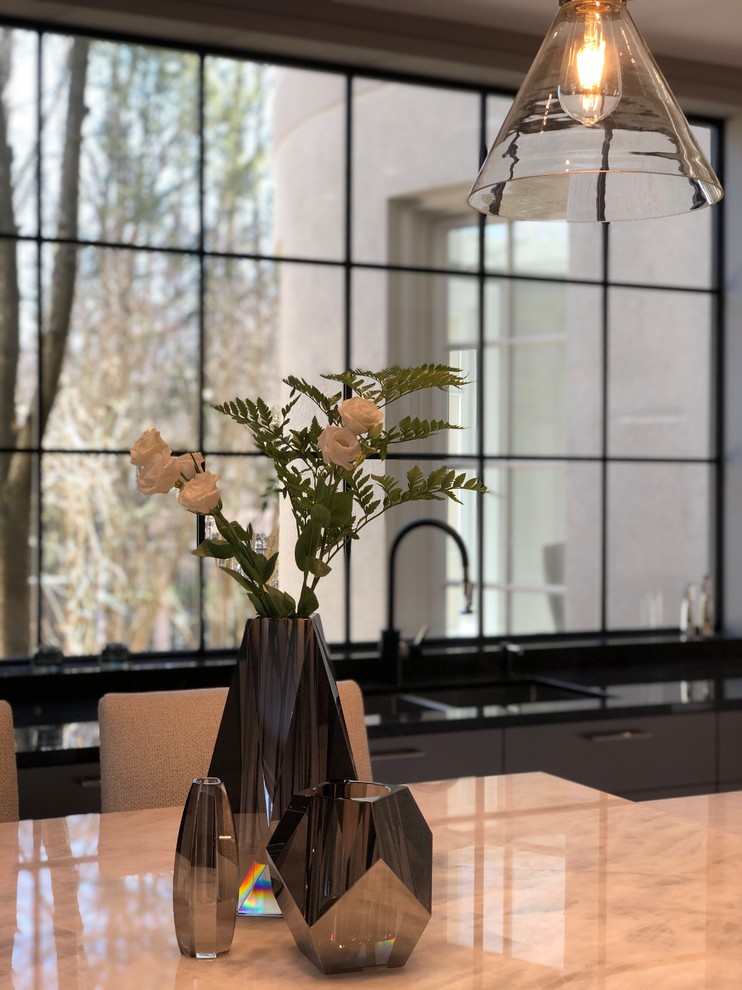 Inspiration for a large contemporary u-shaped porcelain tile and white floor enclosed kitchen remodel in Toronto with flat-panel cabinets, quartzite countertops, white backsplash, stone slab backsplash, an island, white countertops, a single-bowl sink, white cabinets and stainless steel appliances