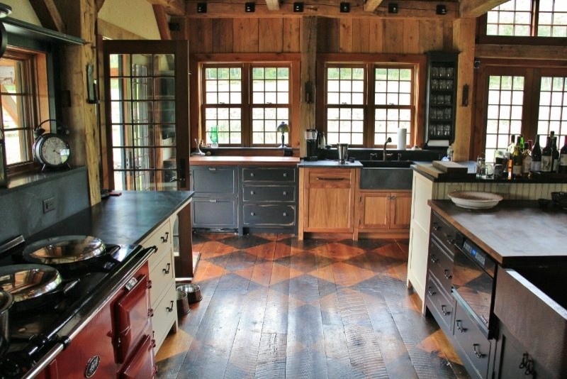 Design ideas for a traditional open plan kitchen in Burlington with a farmhouse sink, medium hardwood floors and with island.