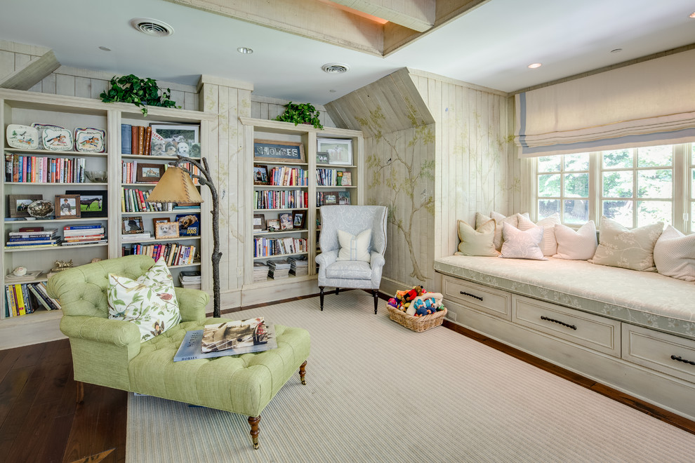 Photo of a large traditional open concept family room in DC Metro with medium hardwood floors, a library, multi-coloured walls and brown floor.