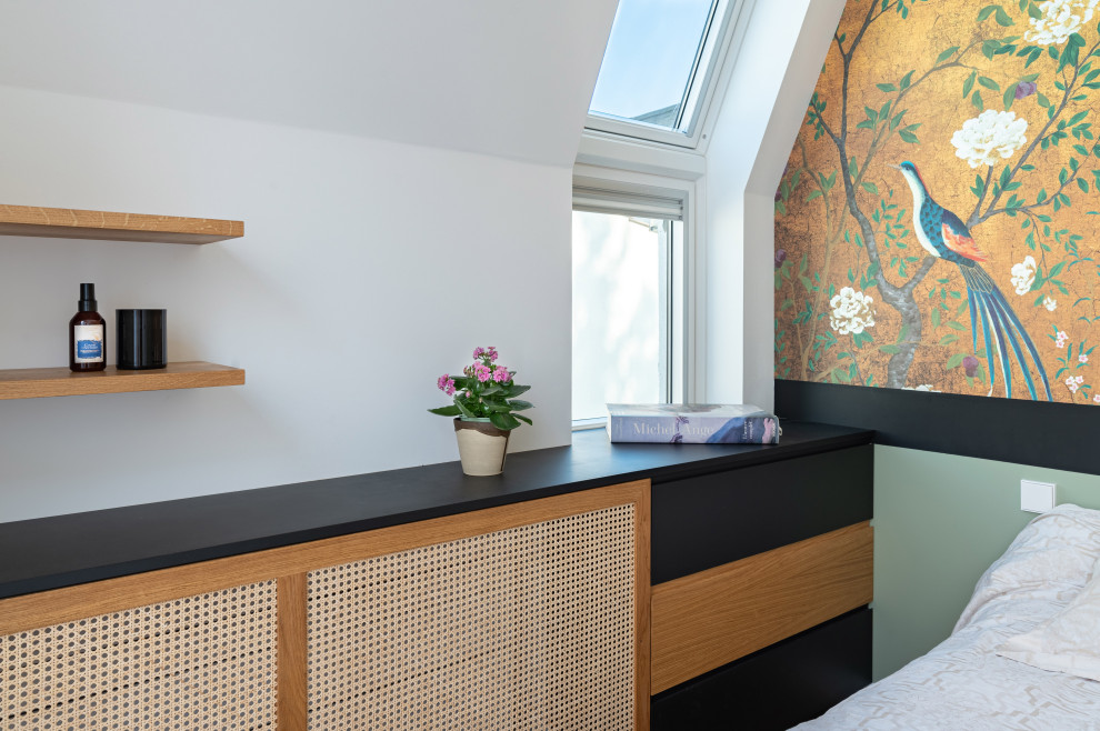 Bedroom - small contemporary master light wood floor and wallpaper bedroom idea in Paris with green walls