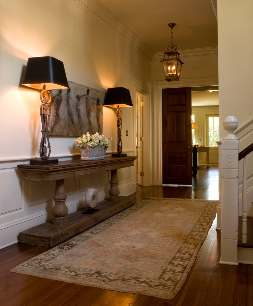 Mid-sized traditional foyer in Charleston with yellow walls and medium hardwood floors.