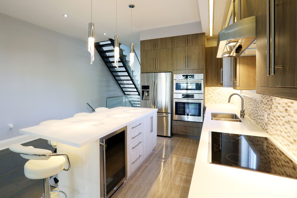 Mid-sized contemporary l-shaped open plan kitchen in Toronto with a double-bowl sink, flat-panel cabinets, dark wood cabinets, marble benchtops, multi-coloured splashback, matchstick tile splashback, stainless steel appliances, porcelain floors and with island.
