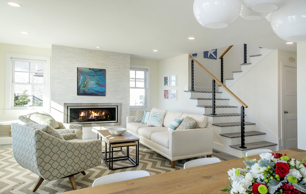 Beach style formal open concept living room in Boston with white walls, no tv, a ribbon fireplace and a metal fireplace surround.