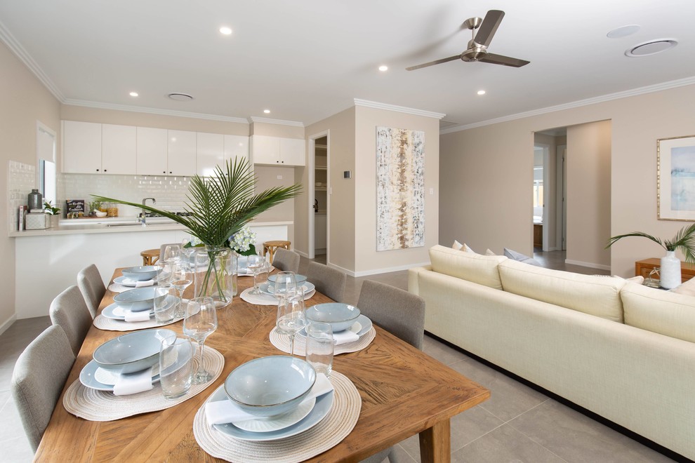 Design ideas for a mid-sized modern open plan dining in Brisbane with beige walls, ceramic floors and beige floor.